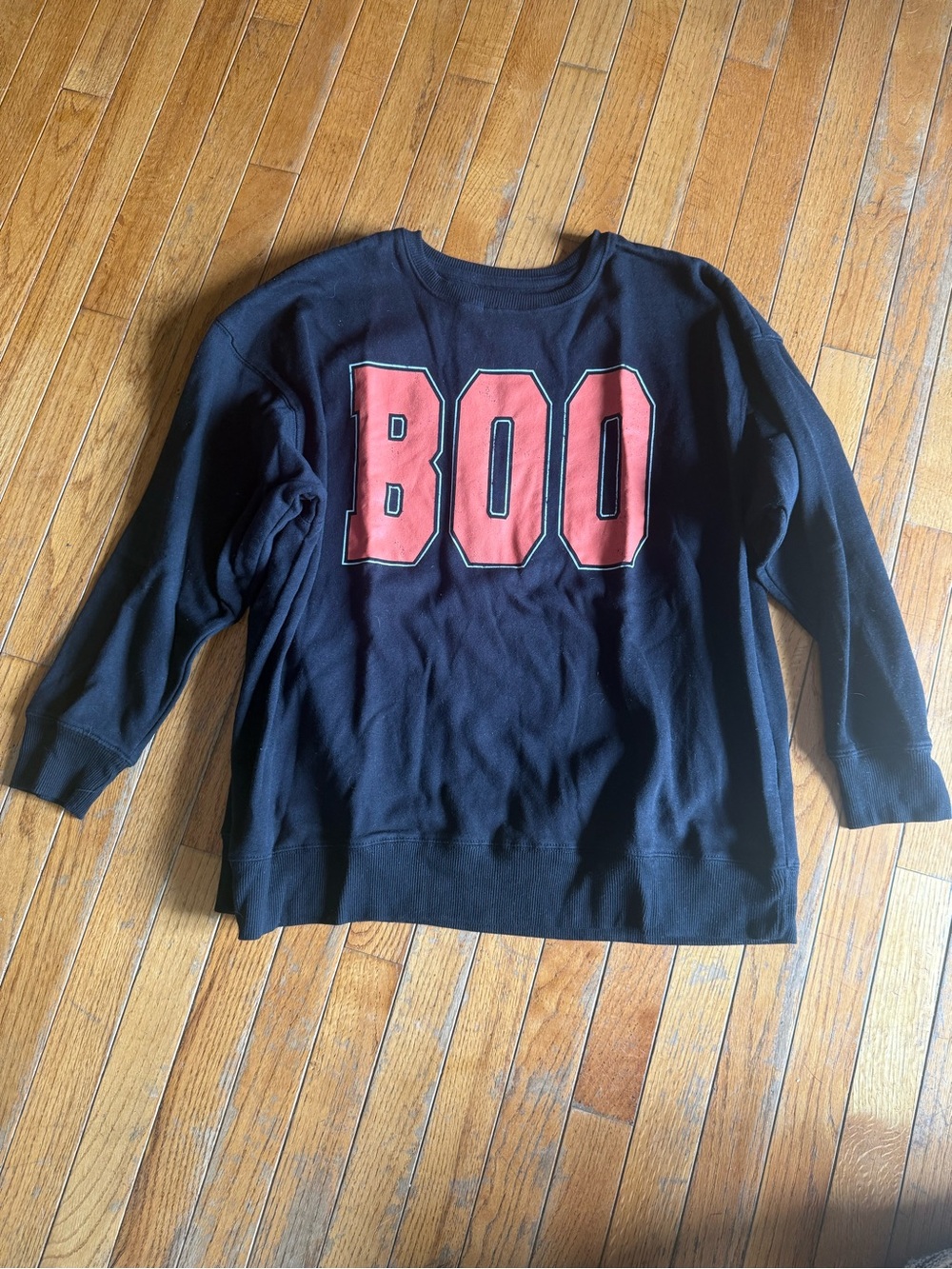 Black Sweatshirt with orange "BOO" Graphic